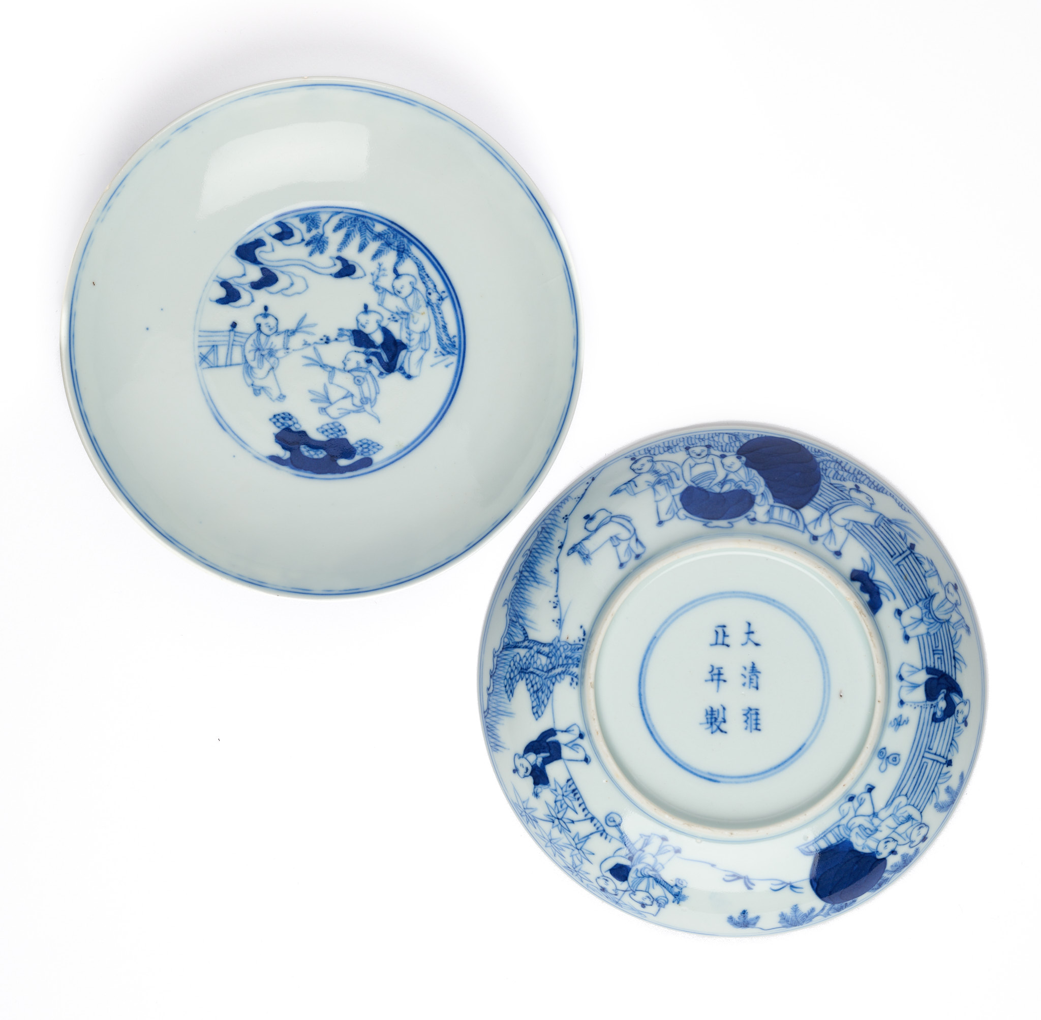 A PAIR OF CHINESE BLUE AND WHITE 'BOYS' SAUCER DISHES, QING DYNASTY, 19TH CENTURY