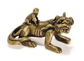 A CHINESE BRONZE 'KYLIN AND MONKEY' SCROLL WEIGHT, QING DYNASTY