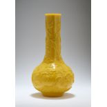 A CHINESE CARVED OPAQUE LEMON-YELLOW GLASS BOTTLE VASE, LATE QING DYNASTY, 19TH CENTURY
