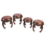 A RARE SET OF FOUR CHINESE HUALI DRUM STOOLS, QING DYNASTY, LATE 18TH/EARLY 19TH CENTURY