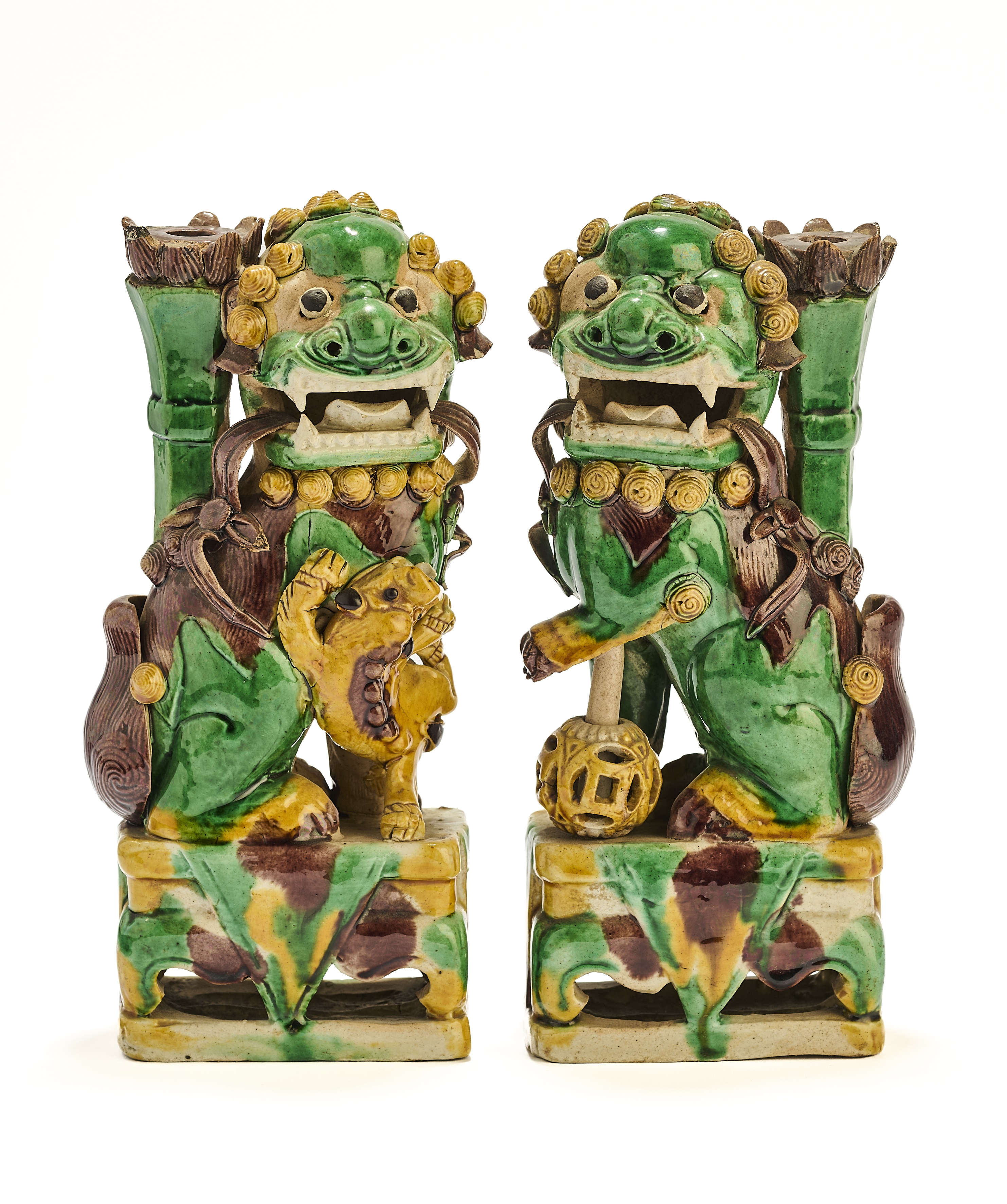 A PAIR OF CHINESE BISCUIT BUDDHIST LION INCENCE HOLDERS, QING DYNASTY, KANGXI PERIOD (1662-1722)