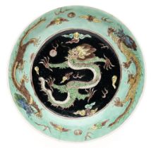 A CHINESE FAMILLE-NOIR 'DRAGON' DISH, KANGXI PERIOD (1662-1722)