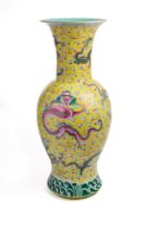 A LARGE CHINESE FAMILLE-ROSE YELLOW-GROUND 'NINE DRAGON' VASE, QING DYNASTY