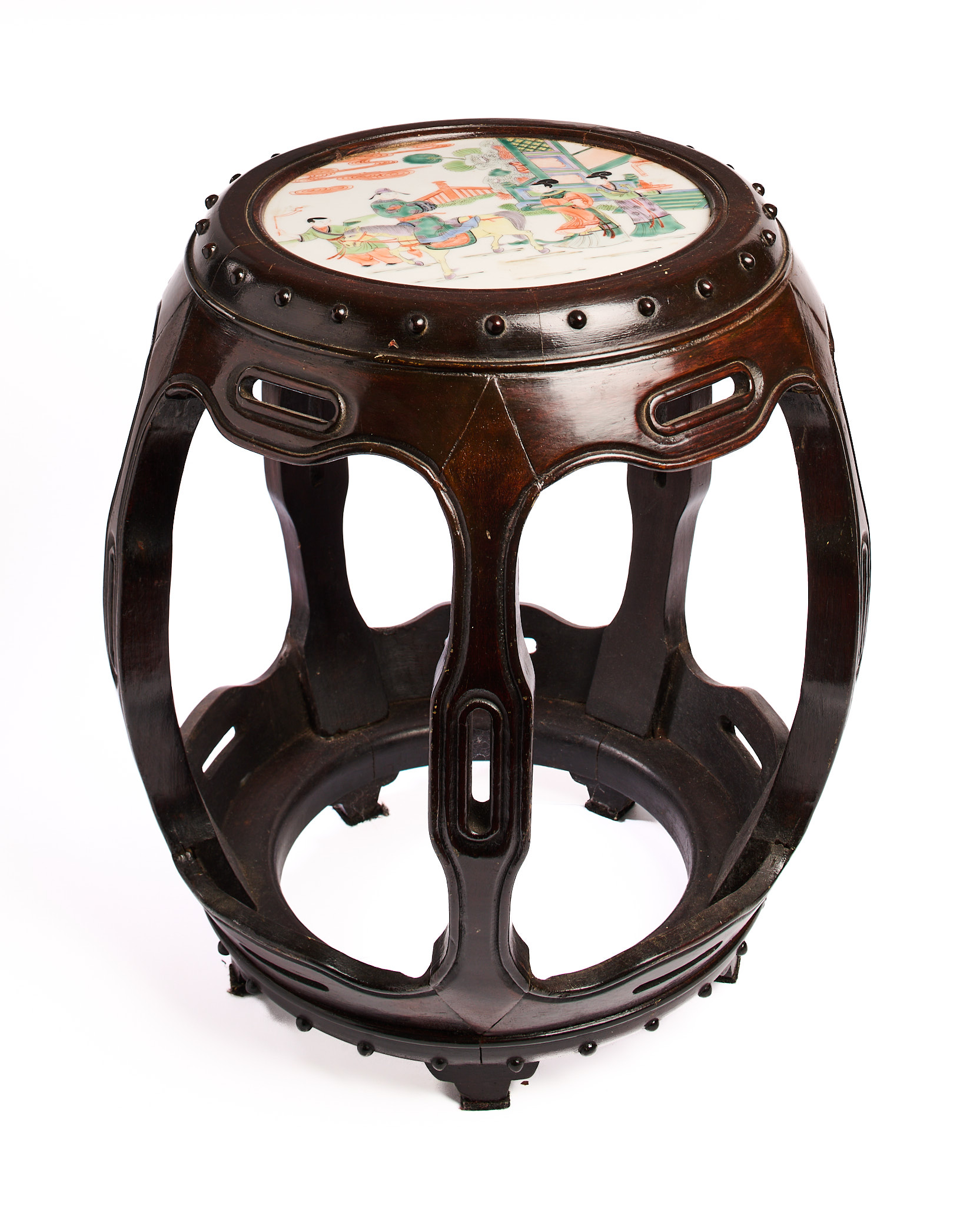 A CHINESE WOOD DRUM STOOL INSET WITH A FAMILLE-VERTE PLAQUE, QING DYNASTY, CIRCA 1900