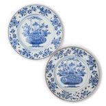 A PAIR OF CHINESE BLUE AND WHITE 'FLOWER BASKET' PLATES, QING DYNASTY, KANGXI PERIOD (1662-1722)