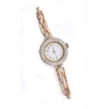 A LADY'S DIAMOND AND GOLD WRISTLET WATCH, SWISS, CIRCA 1914