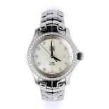 TAG HEUER, LINK: A LADY'S DIAMOND AND STAINLESS STEEL BRACELET WATCH, CIRCA 2005