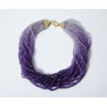 AN AMETHYST BEAD NECKLACE