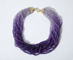 AN AMETHYST BEAD NECKLACE