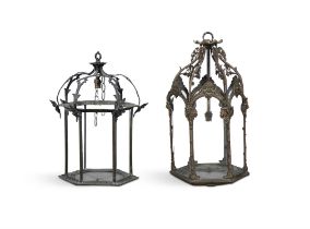 TWO METAL FRAMED HEXAGONAL LANTERNS one applied with lion mask decoration, the other with