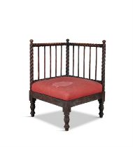 A VICTORIAN MAHOGANY ROPETWIST CORNER CHAIR with rope twist crest rail and supports,