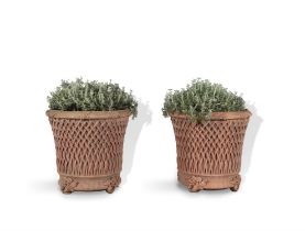 A PAIR OF TERRACOTTA PLANTERS, 20TH CENTURY, decorated in the form of baskets,