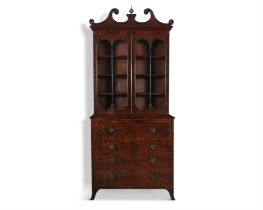 A FINE GEORGE IV MAHOGANY SECRETAIRE BOOKCASE. with broken swan neck pediment,