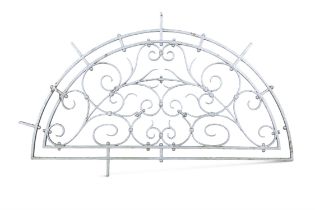 A PAINTED CAST IRON DEMI-LUNE OPEN-FRAMED ARCH, the twin frame containing open scrollwork