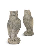 A PAIR OF CARVED SANDSTONE OWLS, each c.70.5cm high