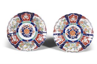A PAIR OF JAPANESE IMARI SHAPED CIRCULAR CHARGERS, 19TH CENTURY each 37cm wide