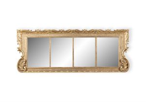 AN IRISH GEORGE III GILTWOOD COMPARTMENTAL MIRROR, of oblong shape fitted with four bevelled