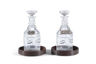 A PAIR OF IRISH CUT GLASS DECANTERS AND STOPPERS, 19TH CENTURY with flat mushroom stoppers,