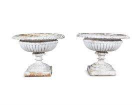 A PAIR OF VICTORIAN WHITE PAINTED CAST IRON GARDEN URNS, of campagna form, each with out-turned