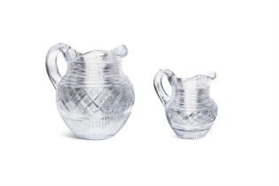 TWO 19TH CENTURY CUT GLASS JUGS of melon shape, the bodies cut with bands of diamonds with