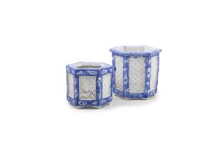 TWO JAPANESE BLUE AND WHITE RETICULATED OCTAGONAL VASES with pierced sides. 12cm high; 9.5cm high