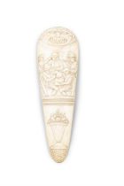 * AN 18TH CENTURY IVORY TOBACCO RASP, carved with a group of revellers, with grotesque mask and