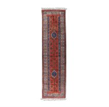 A NORTH WEST PERSIAN WOOL RUNNER. 350 X 83CM signed with initials 'S. U', the oblong red field