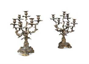 A PAIR OF FRENCH BRONZE SIX LIGHT CANDELABRA, in the rococo taste, 53 cm high