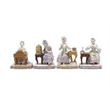 A COLLECTION OF FOUR MEISSEN PORCELAIN FIGURAL GROUPS DEPICTING THE SENSES each seated at