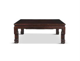 A CHINESE CARVED HARDWOOD LOW TABLE, LATE QING DYNASTY, of square shape with carved masked legs.