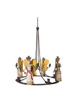 A WROUGHT METAL FOLK ART CEILING LIGHT the flat circular ring fitted with four carved and