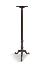 A GEORGE III STYLE MAHOGANY TORCHÈRE STAND, with circular top, raised on a fluted pillar and