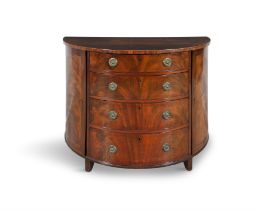 A GEORGE III FLAME MAHOGANY DEMI-LUNE COMMODE, C. 1790 the top with satinwood stringing to the