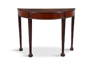 A MAHOGANY DEMI-LUNE PIER TABLE raised on tapering legs with block feet. 106cm wide; 82cm high;