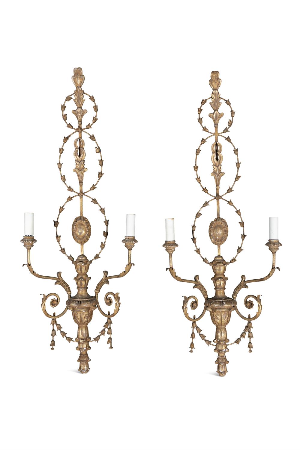 A PAIR OF CARVED GILTWOOD AND GESSO TWO BRANCH WALL SCONCES, c. 1900, of classical design with