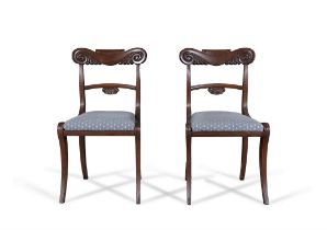 A PAIR OF MAHOGANY WILLIAM IV DINING CHAIRS the crest rail carved with scrollwork design and