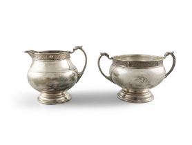 AN IRISH SILVER THREE PIECE CELTIC REVIVAL TEA SERVICE, Dublin c.1980, mark of Alwright &