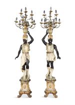 A PAIR OF ITALIAN PAINTED AND GILDED BLACKAMOOR FIGURAL LAMPS each dressed in Venetian garb,