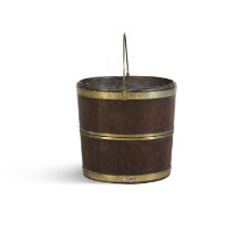 A MAHOGANY AND BRASS BOUND FUEL BUCKET, 19TH CENTURY of oval form, with brass carrying handle,