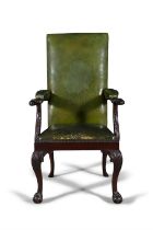 A 19TH CENTURY MAHOGANY OPEN ARMCHAIR, the padded rectangular back and seat covered in a green