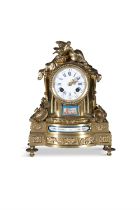 A SMALL 19TH CENTURY FRENCH ORMOLU MANTLE CLOCK, inset with Sevres facet panels,