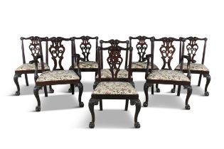 A SET OF EIGHT CARVED MAHOGANY DINING CHAIRS each openwork back leaf and shell carved toprail