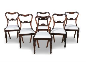 A SET OF SIX ROSEWOOD DINING CHAIRS with curved crest rail, anthemion splat, white upholstered