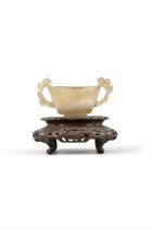 AN AGATE FOLIATE-SHAPED CUP AND A RETICULATED CARVED WOOD STAND 明代 瑪瑙靈芝耳茶盞及透雕木座 China,