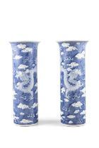 A PAIR OF BLUE AND WHITE ‘DRAGON AND CLOUDS’ HATSTANDS 中國19世紀末 青花雲龍紋帽筒瓶一對 China,