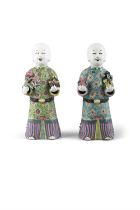 A PAIR OF CHINESE POLYCHROME PORCELAIN FIGURES OF HOHO BROTHERS HOLDING AUSPICIOUS OBJECTS 晚清