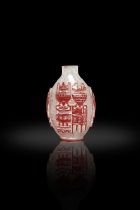A CHINESE RED AND WHITE GLASS CARVING 'ANTIQUES' SNUFF BOTTLE 晚清 套料博古紋鼻煙壺 China,
