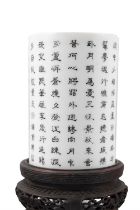 AN INK PAINTED ‘IMPERIAL POEM BY EMPEROR QIANLONG’ PORCELAIN BRUSHPOT WITH WOODEN STAND 晚清