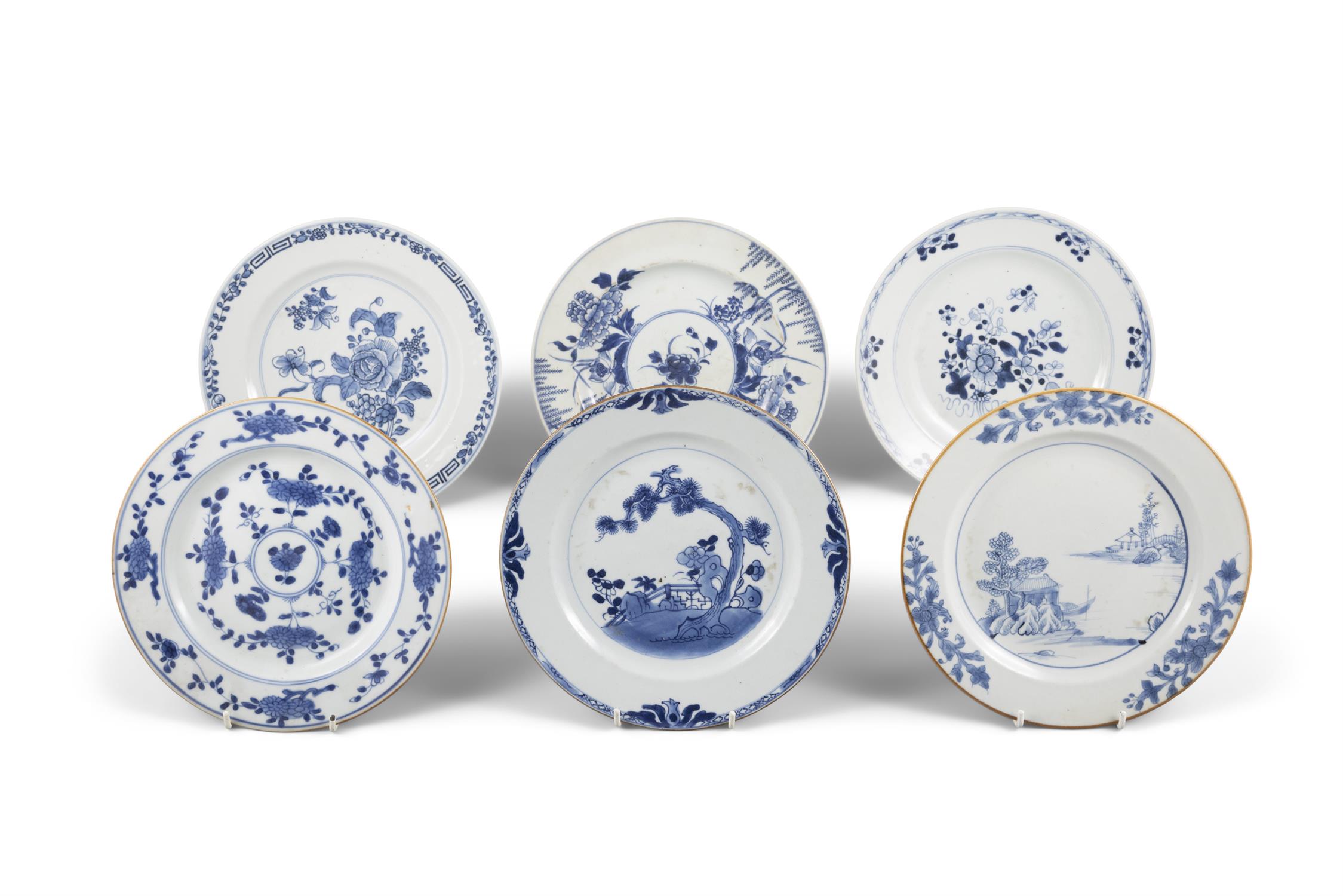 SIX BLUE AND WHITE DISHES WITH FLOWERS AND LANDSCAPE 清乾隆 青花花卉纹盘六件 China, 18th century D: