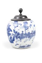 A BLUE AND WHITE ‘QILIN DELIVERING SONS’ JAR WITH A WOODEN COVER 清康熙 青花『麒麟送子』罐 China,